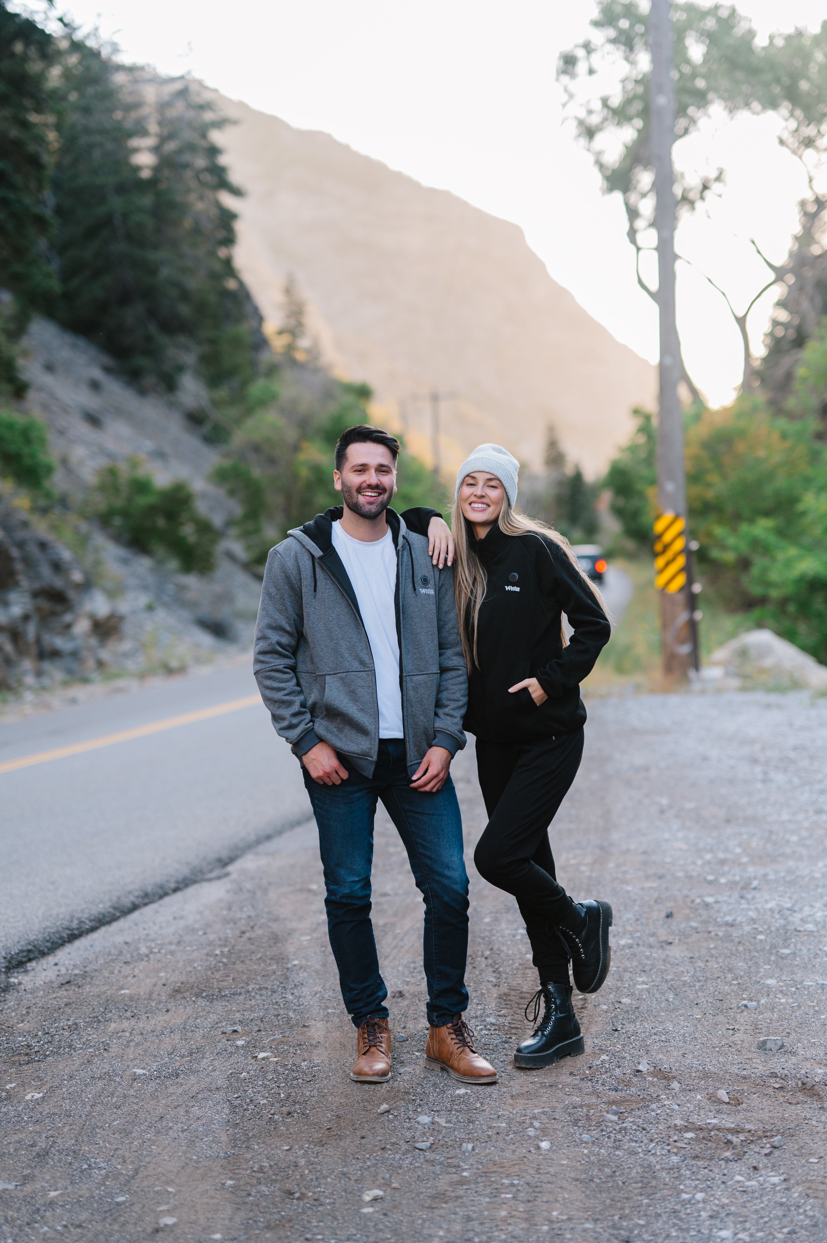 Two people wearing heated outerwear outdoors